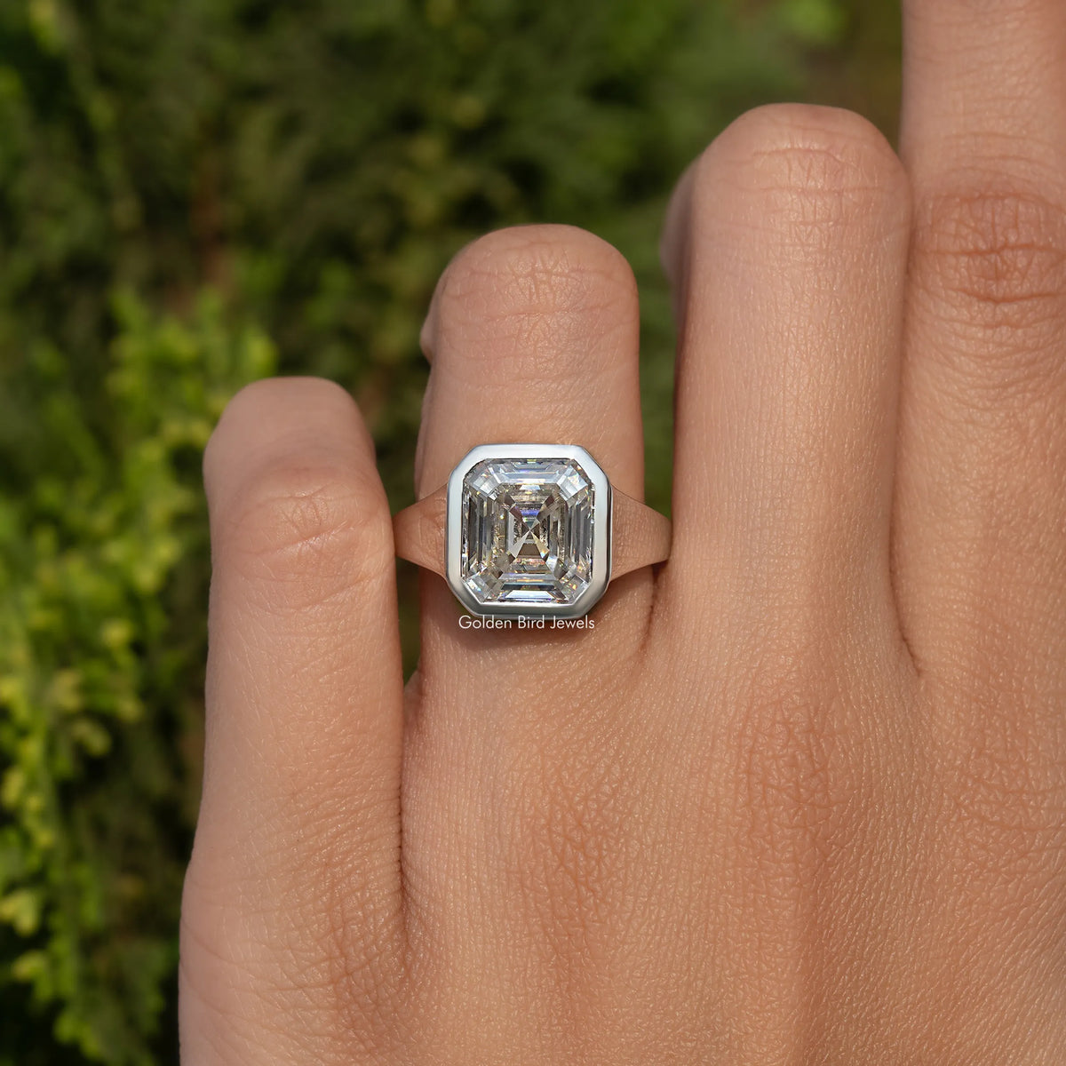 925 sterling silver solitaire ring with bezel-set Asscher-cut moissanite on hand