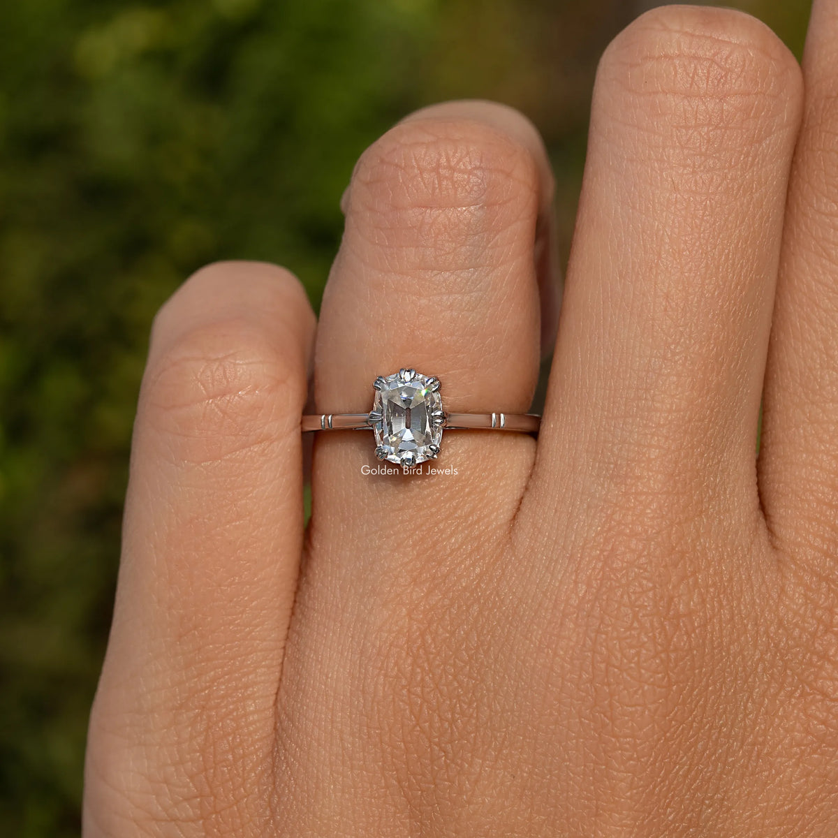 925 sterling silver cushion-cut bridal ring on finger with square center stone