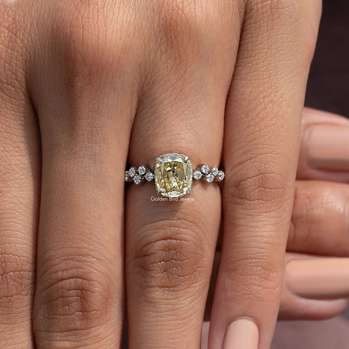 Sterling silver moissanite cluster engagement ring with yellow cushion center and round stones