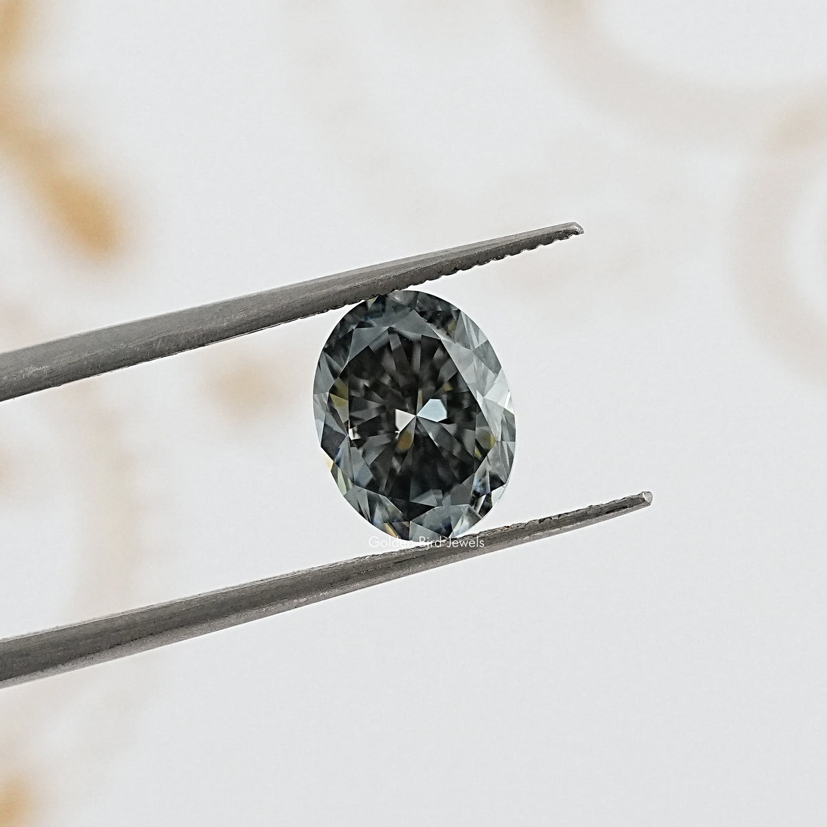 tweezers View of Gray Oval Cut Moissanite