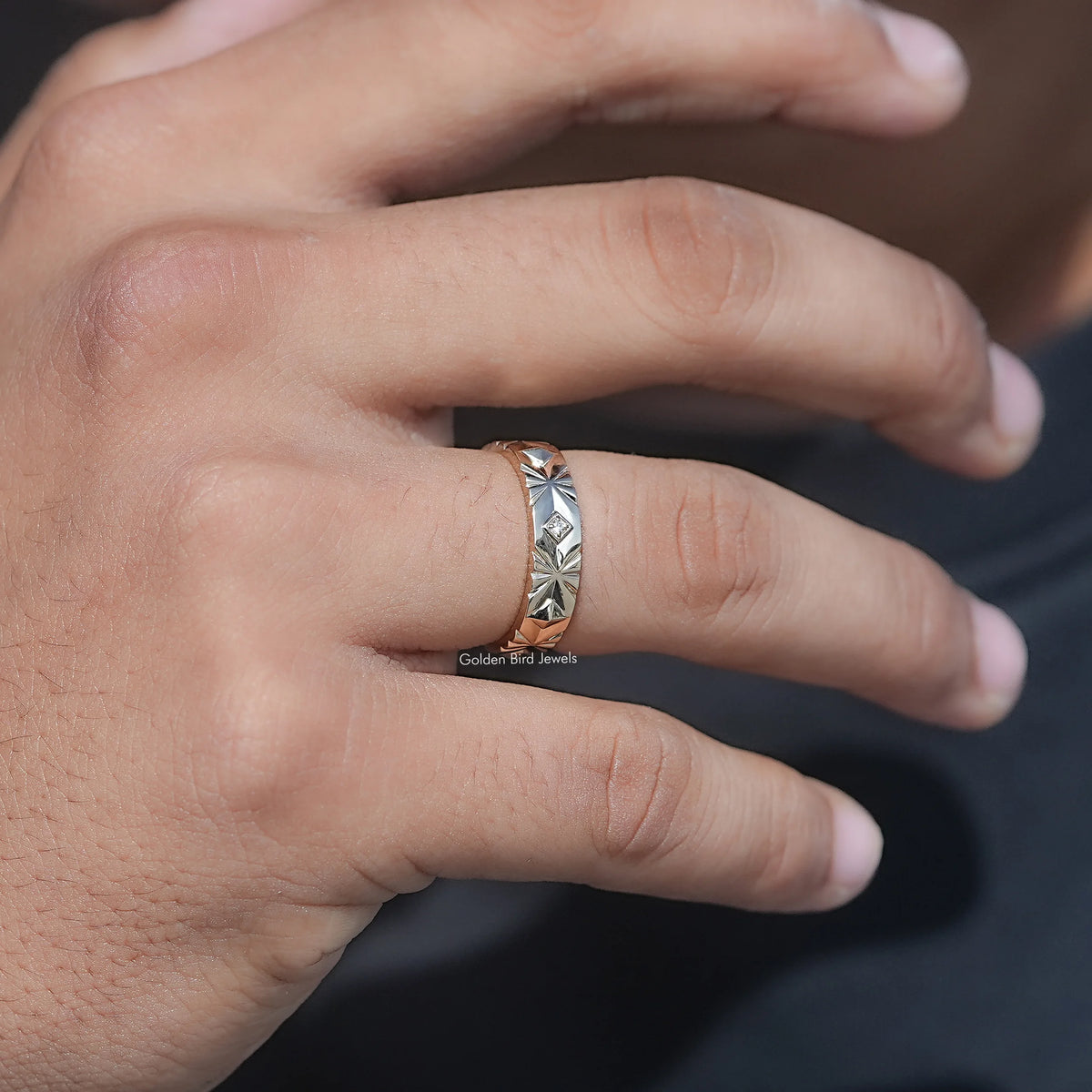 Silver menโs lab-diamond ring on finger, side engraving with small center stone