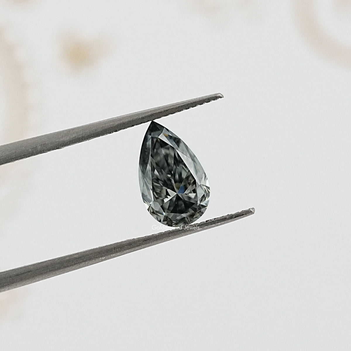 tweezers View of Pear Cut Loose moissanite