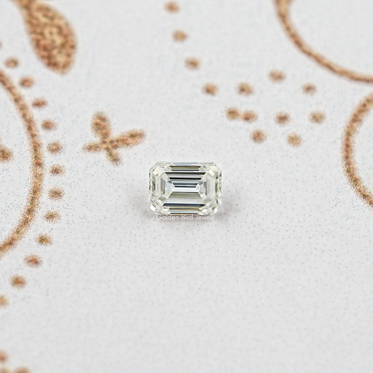 Emerald-cut moissanite loose stone with clear rectangular step-cut facets