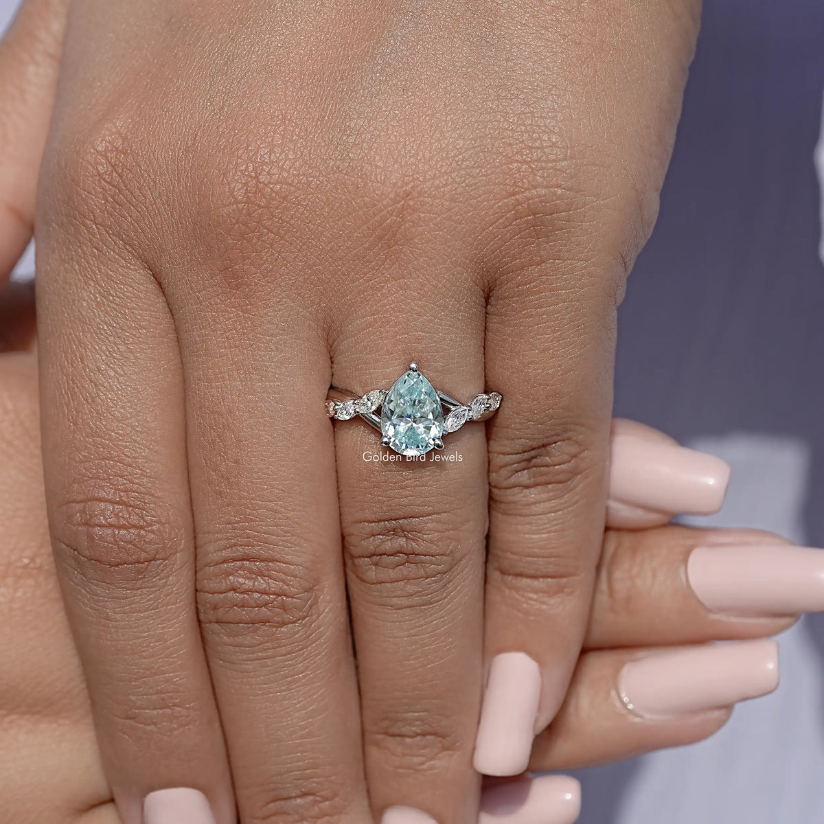 925 sterling silver floral band ring with pear-cut blue moissanite center