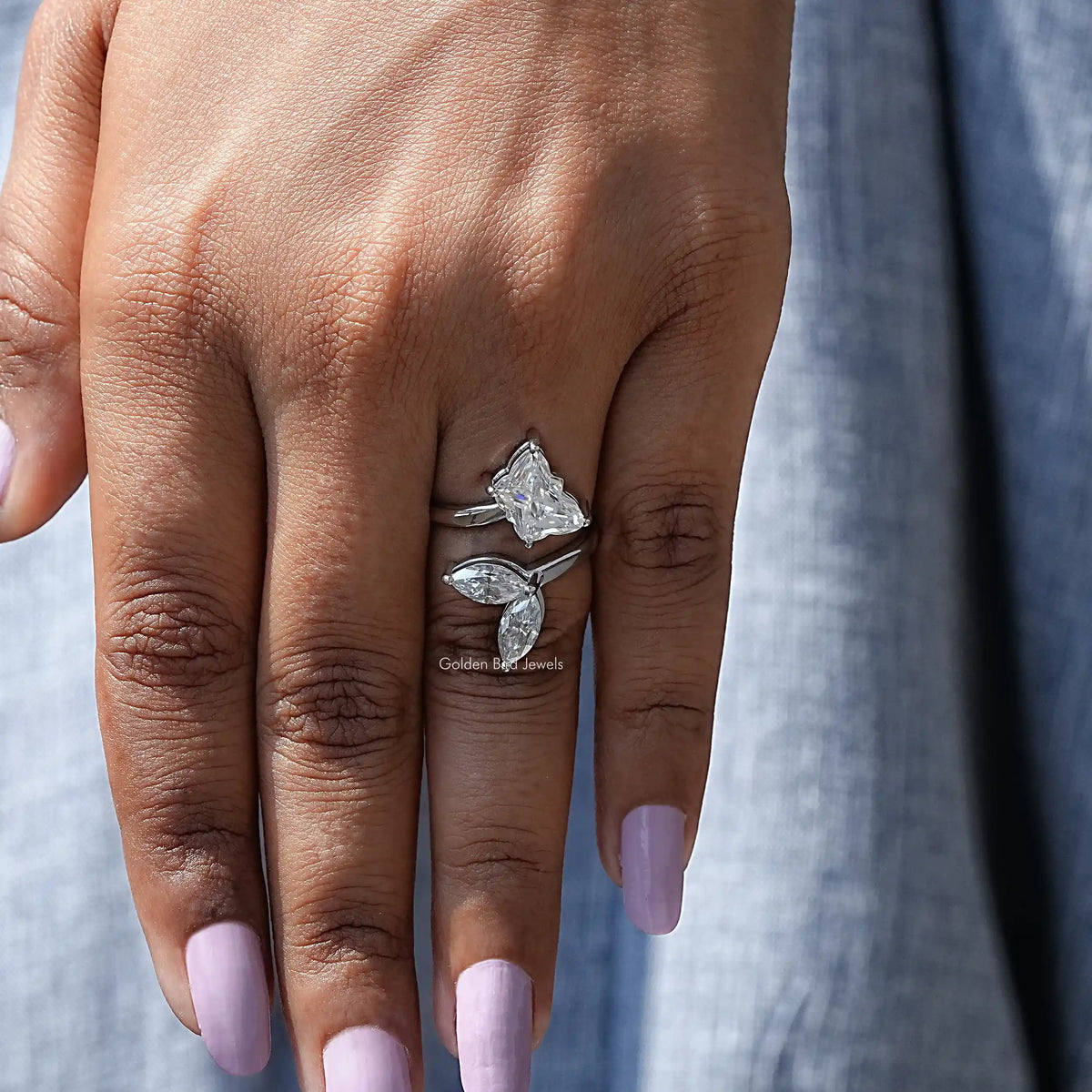 View of Butterfly Cut Moissanite Bypass Ring In finger