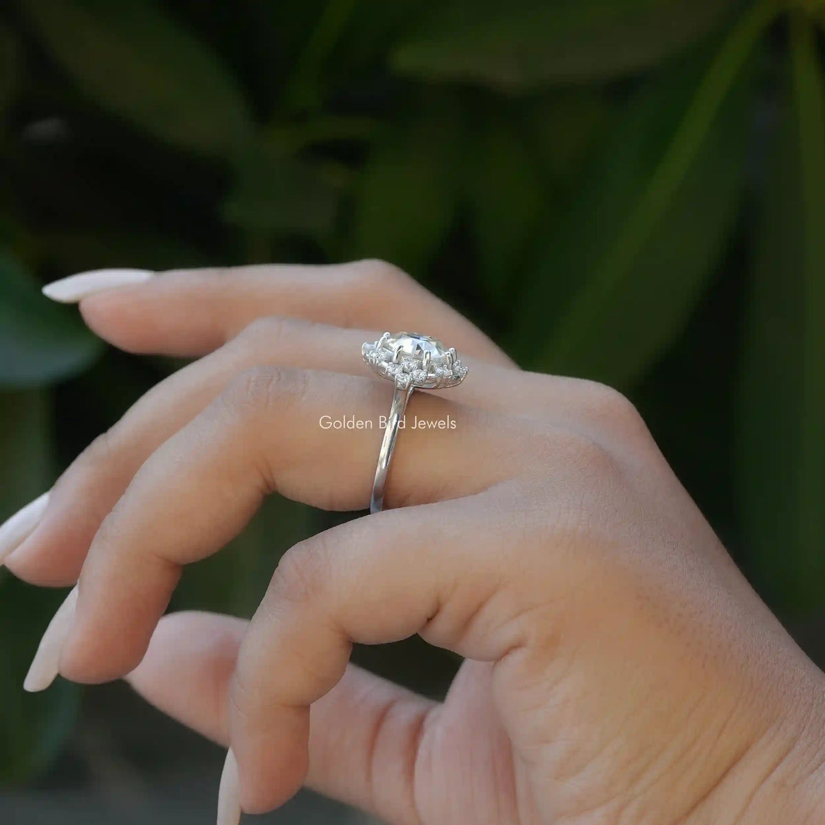 Side View of Round Cut Moissanite Engagement Ring In finger