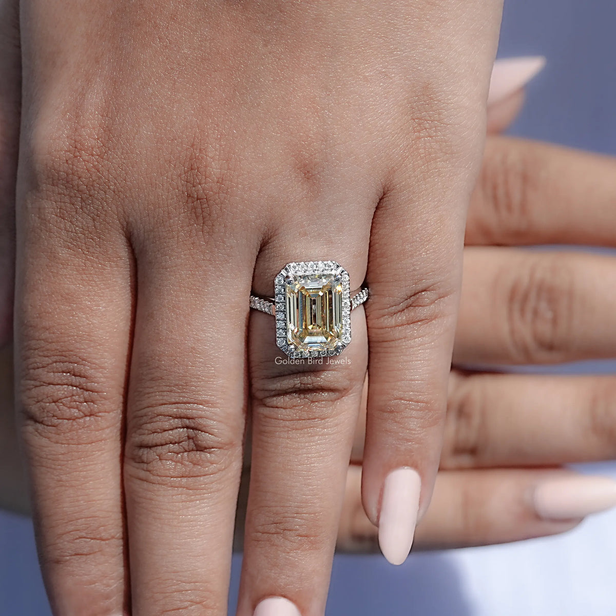 Old mine emerald moissanite halo ring with rectangular center stone and pavรฉ band