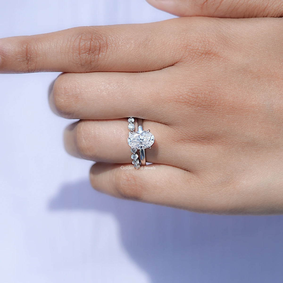 View of solitaire Oval Moissanite ring in prongs setting