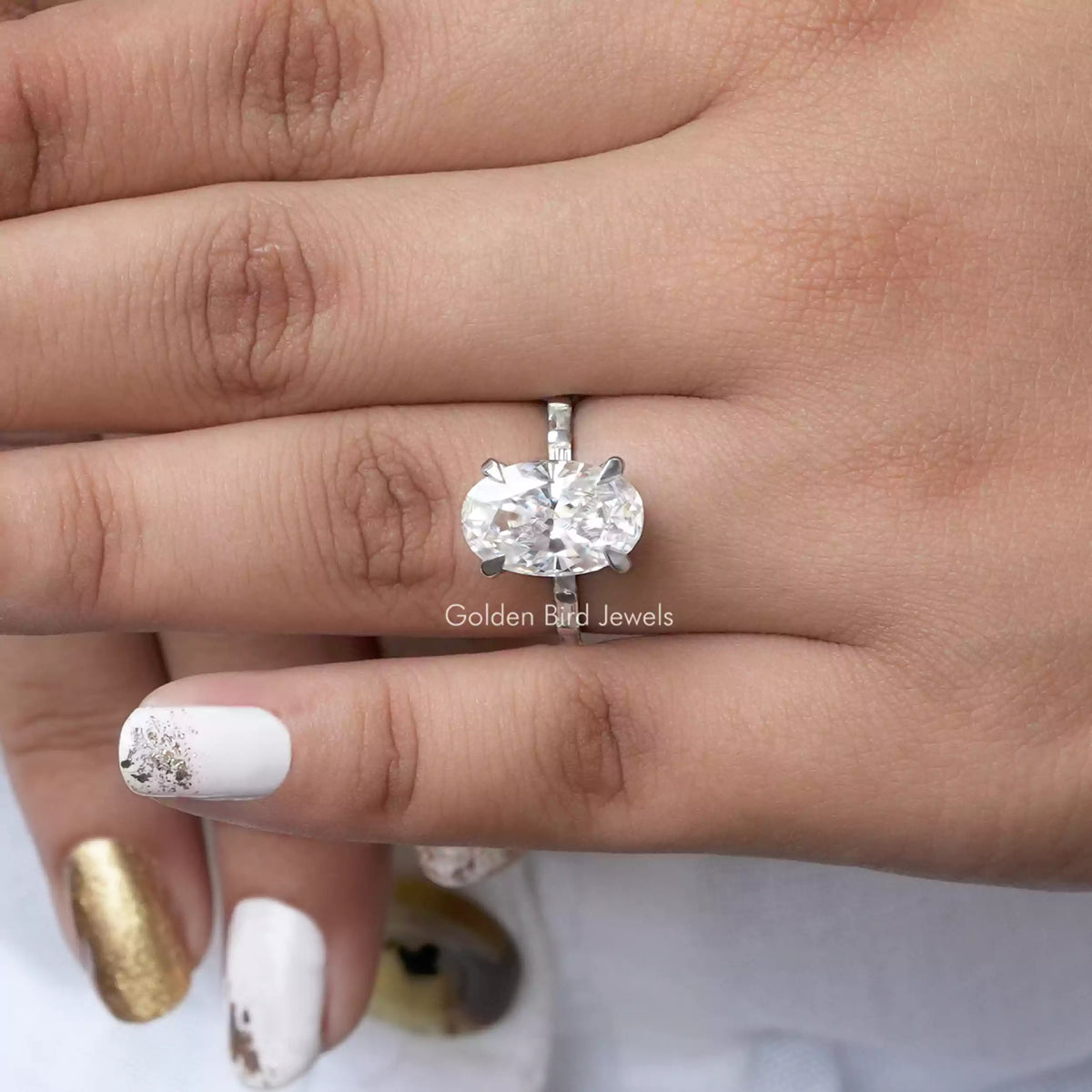 View of Moissanite Oval Cut Accent Stone Ring In finger