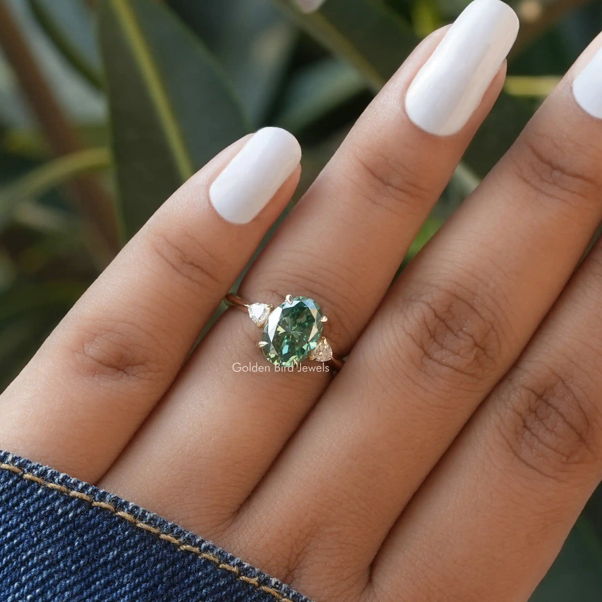 Three Stone Moissanite Engagement Ring In finger