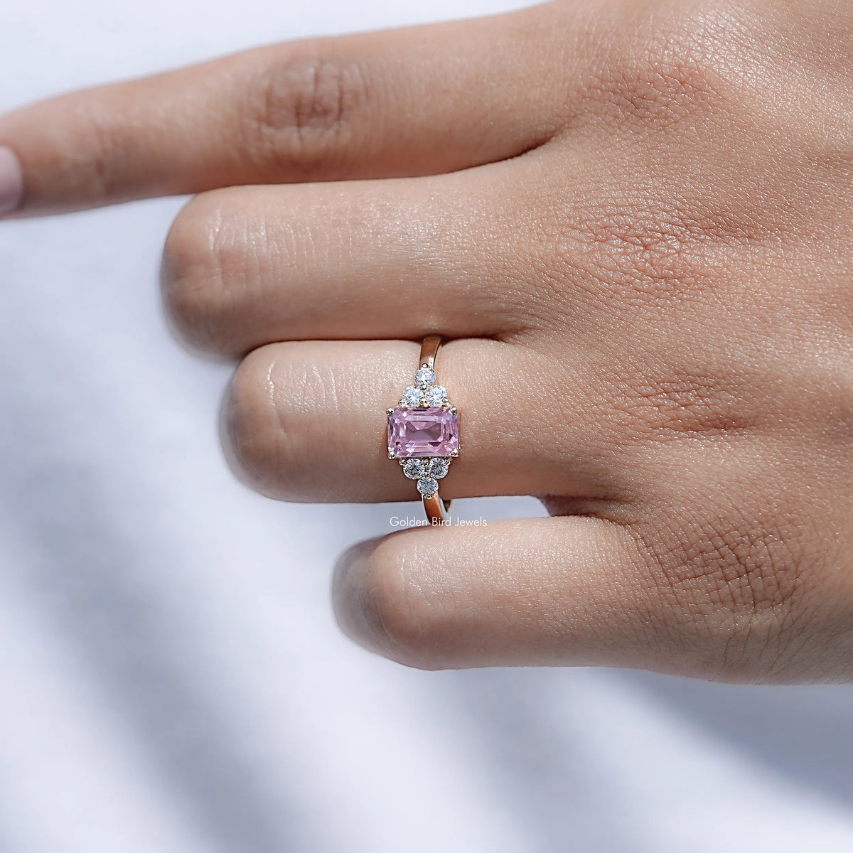 View of Emerald cut Moissanite Ring in prongs setting
