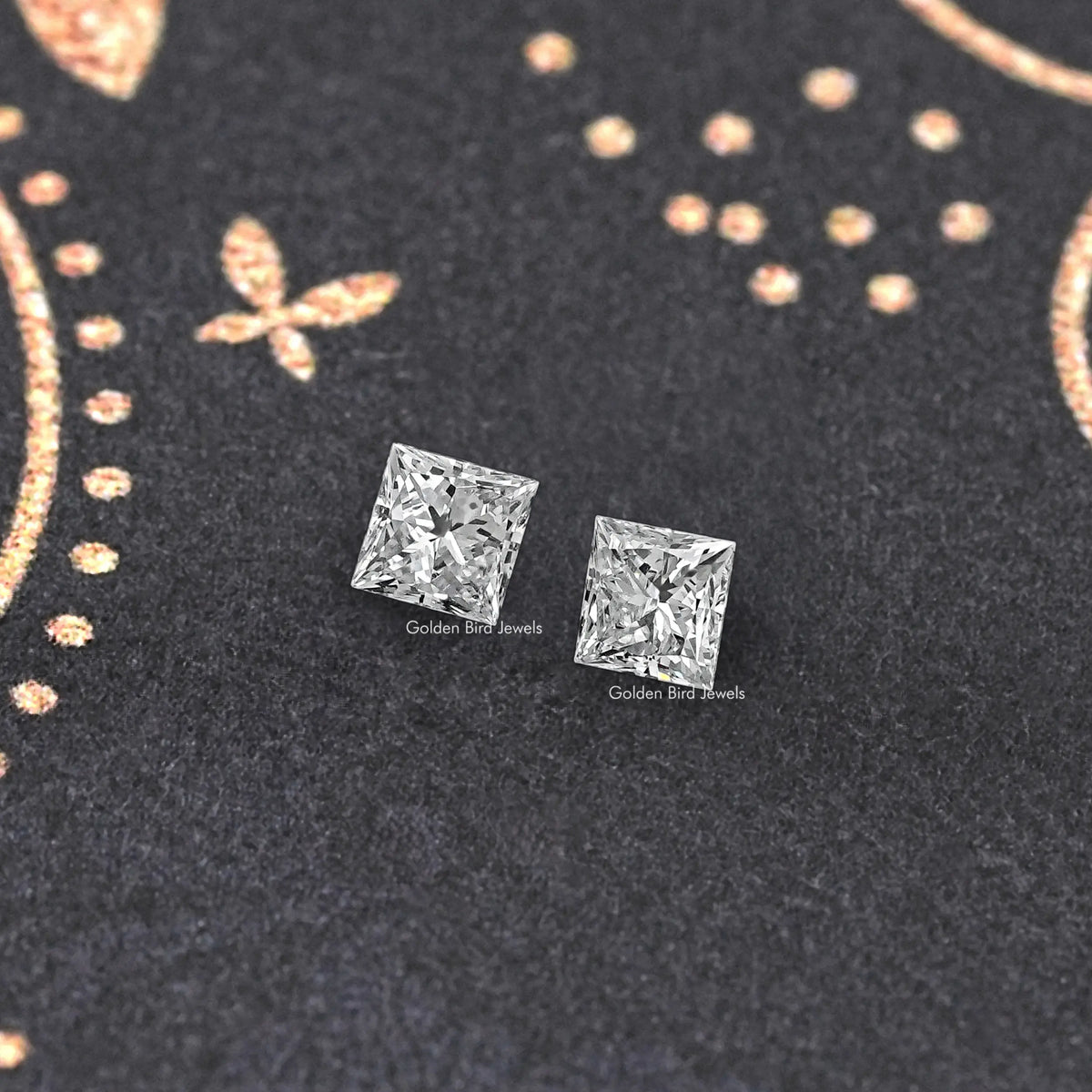 Pair of princess-cut lab-grown diamond squares, two faceted stones on display