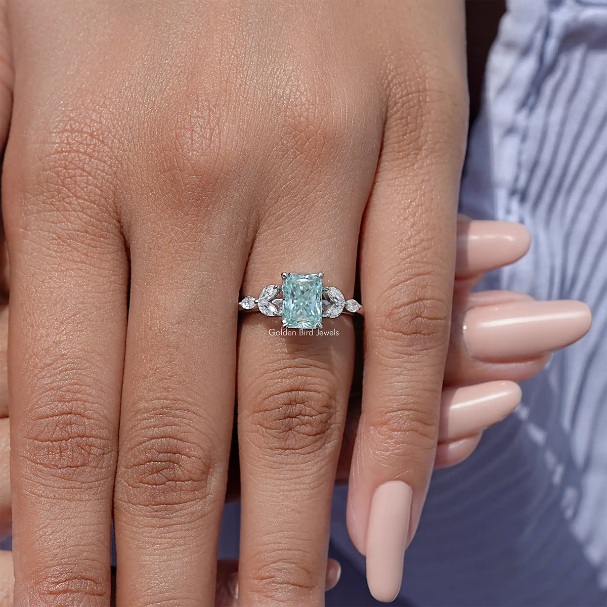 Sterling silver engagement ring with cushion-cut blue-green moissanite center