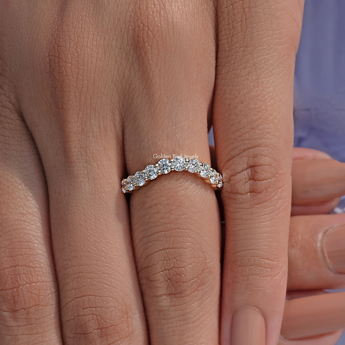 Silver-toned eternity wedding band close-up with round-cut lab diamonds