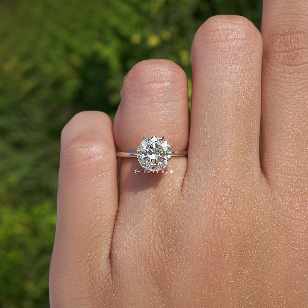 Sterling silver solitaire bridal ring with round-cut moissanite, thin band