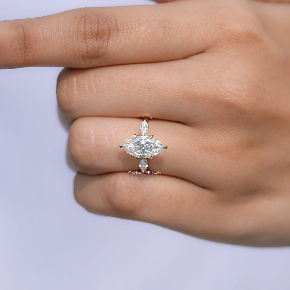View of Pear Cut Marquise Cut Moissanite Three Stone Ring