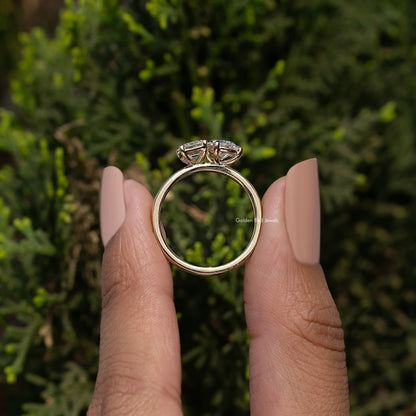 Back View of Emerald And Pear Cut Lab Diamond Ring In two fingers