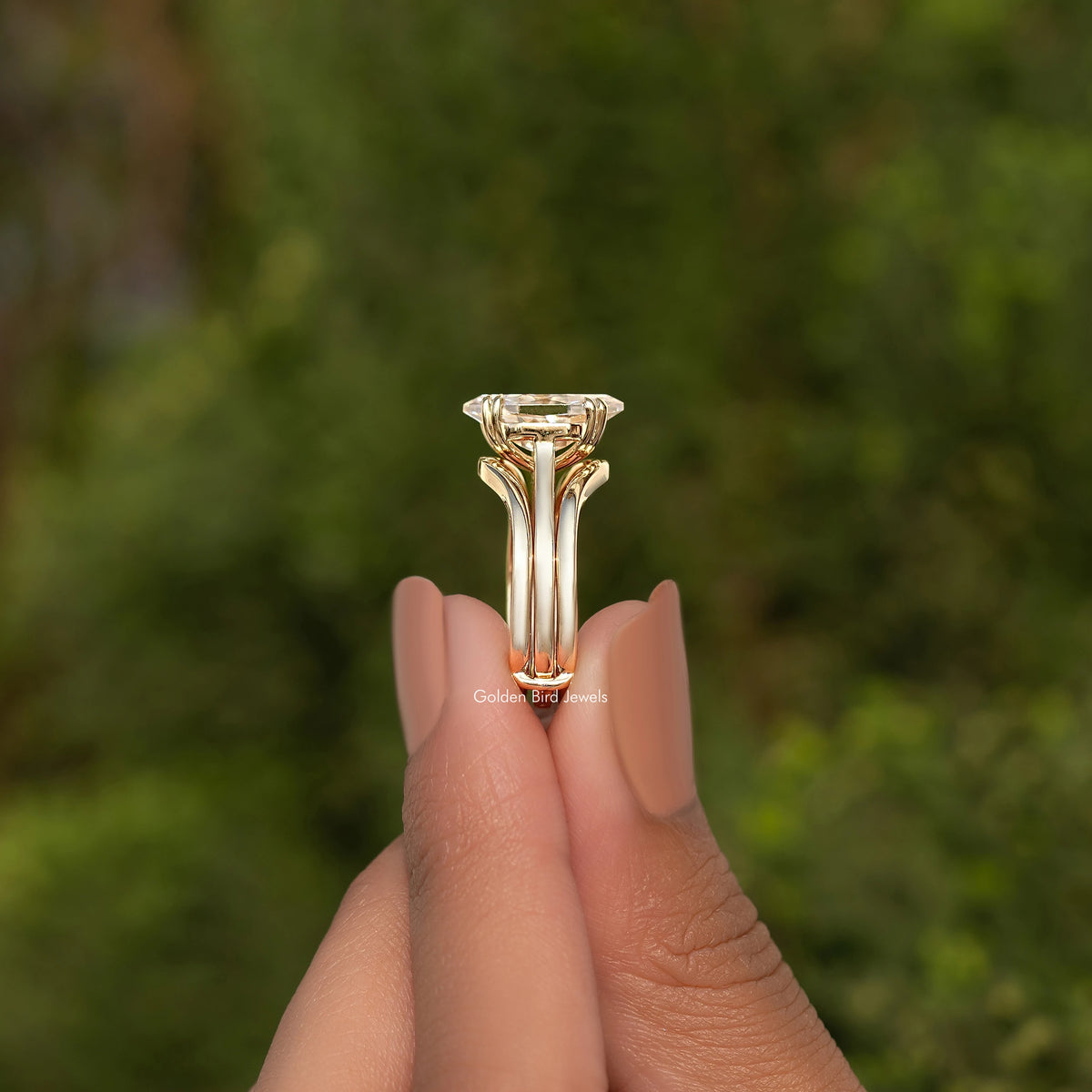 Gold tone engagement ring with large center stone in tall prong setting