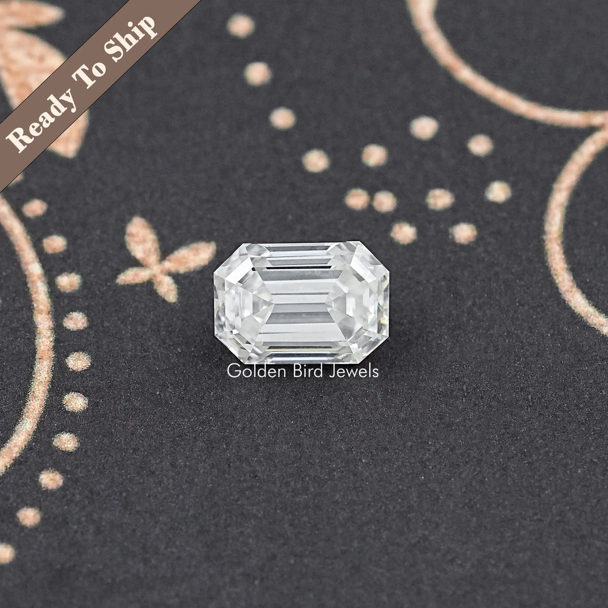 Loose emerald-cut moissanite gemstone, clear front-facing step-cut sparkle