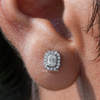 Emerald cut moissanite halo stud earring on ear