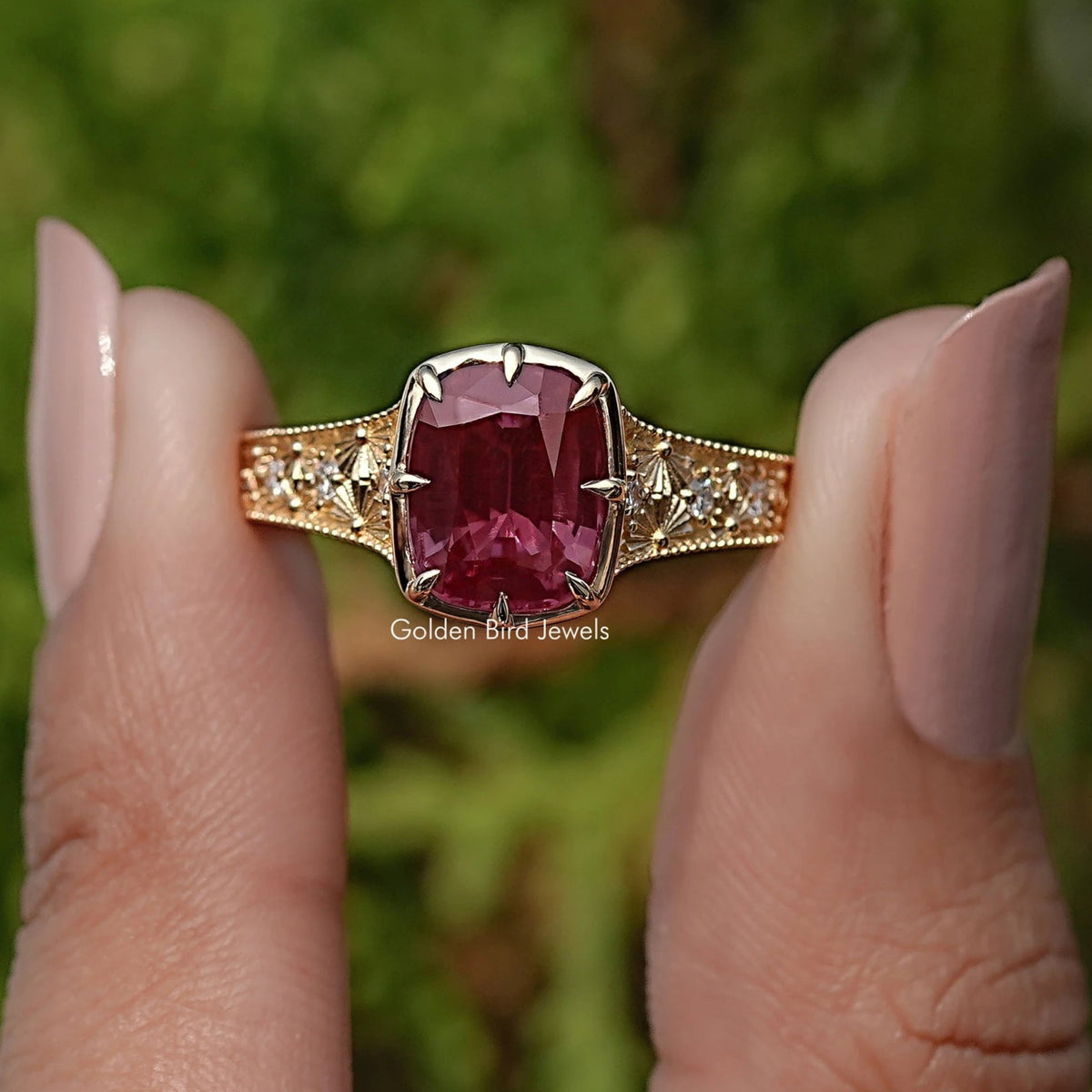 Cushion-cut gemstone ring with pavé shoulders and side stones