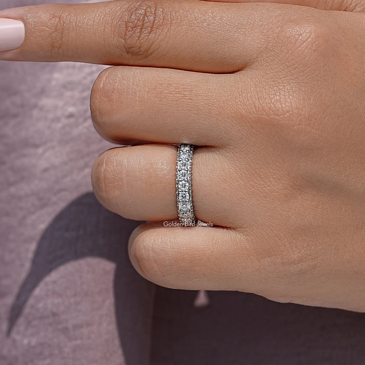 Pavé moissanite eternity band worn on a finger