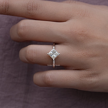 Princess-cut solitaire engagement ring with square center moissanite, four prongs, silver band