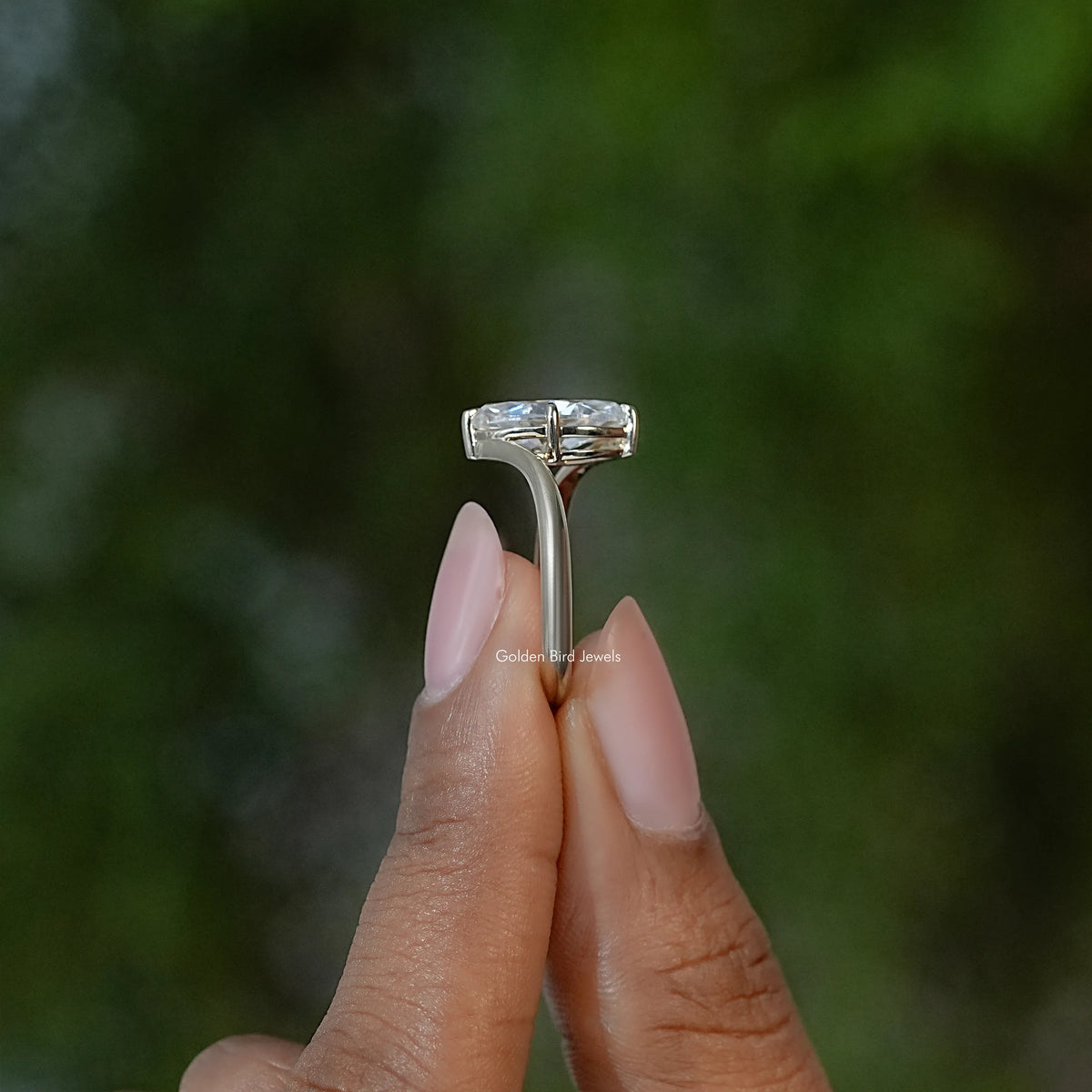 Marquise moissanite solitaire ring top view showing rectangular prong setting