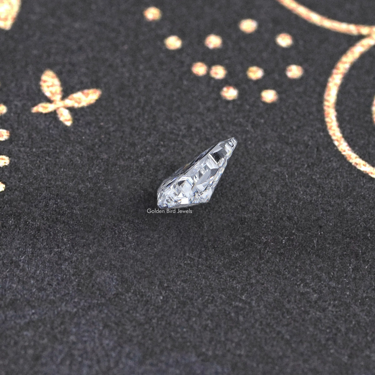 Lab-grown diamond gemstone, faceted triangular cut in side profile