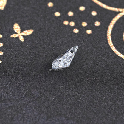 Lab-grown diamond gemstone, faceted triangular cut in side profile