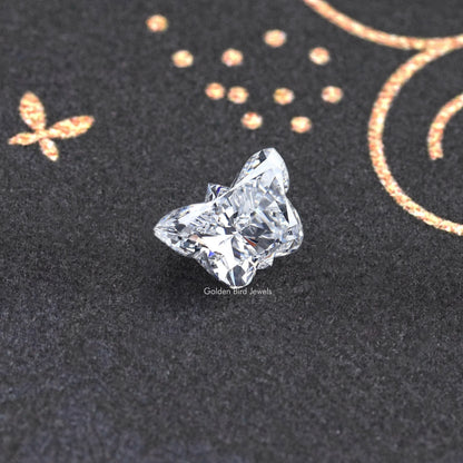 Butterfly-cut lab-grown diamond on dark display, bright princess-style facets