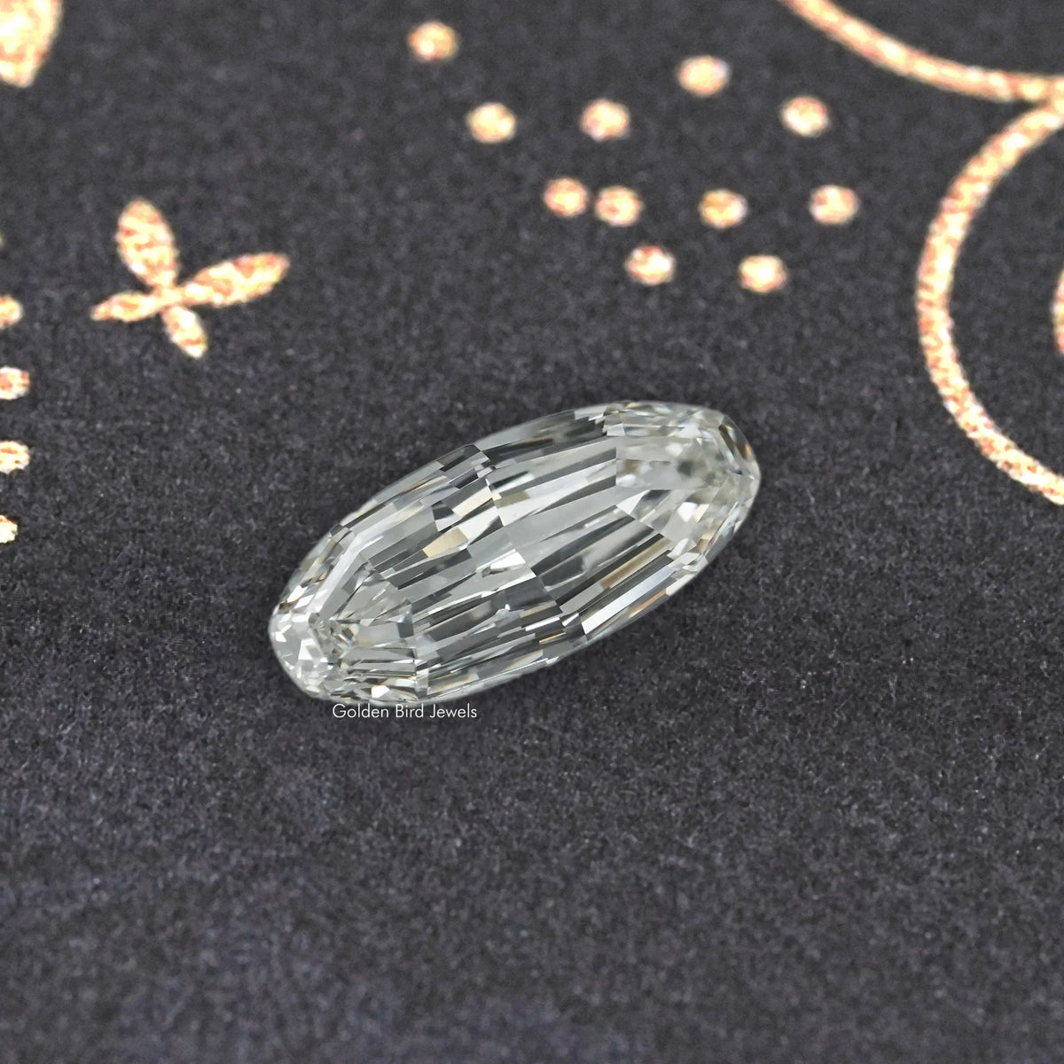 Long oval cut lab-grown diamond with clear, prismatic facets