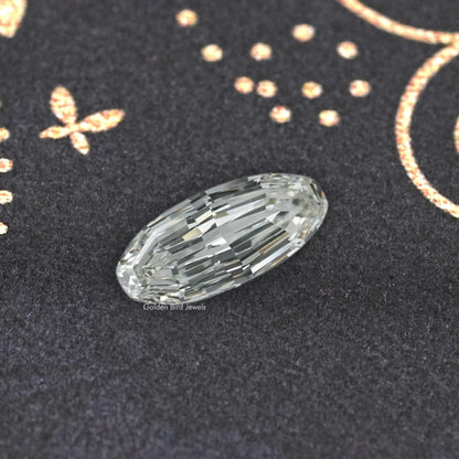 Long oval cut lab-grown diamond with clear, prismatic facets