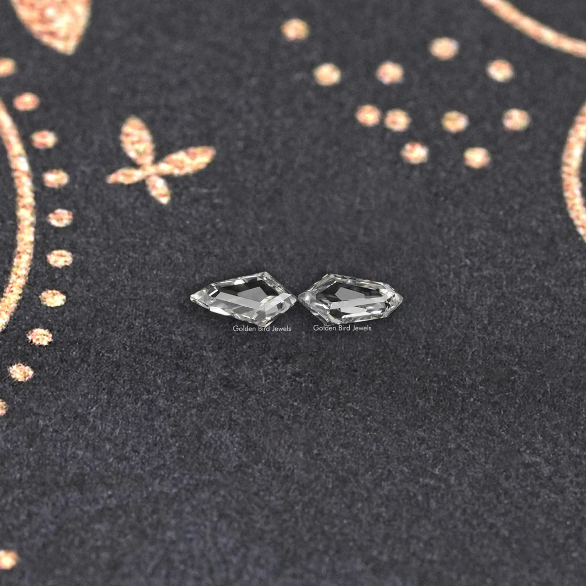 Pair of step-cut lab-grown diamonds, angled for sparkle and shine.