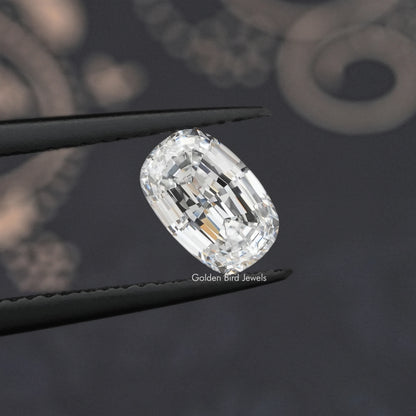 Loose cushion step-cut lab diamond, close-up side angle on dark setting