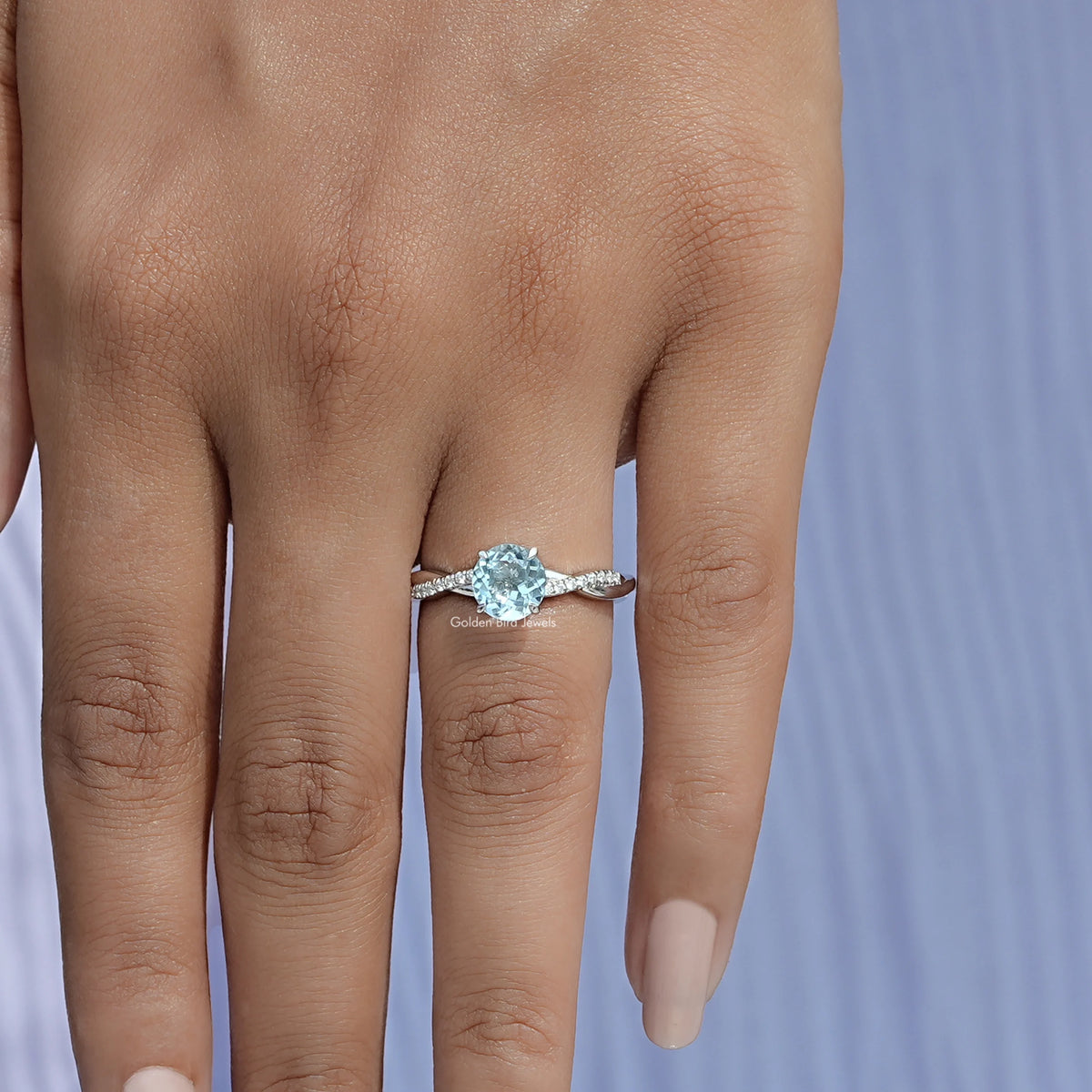 Close-Up View of Blue Aquamarine Round Cut Gemstone Ring In White Gold 