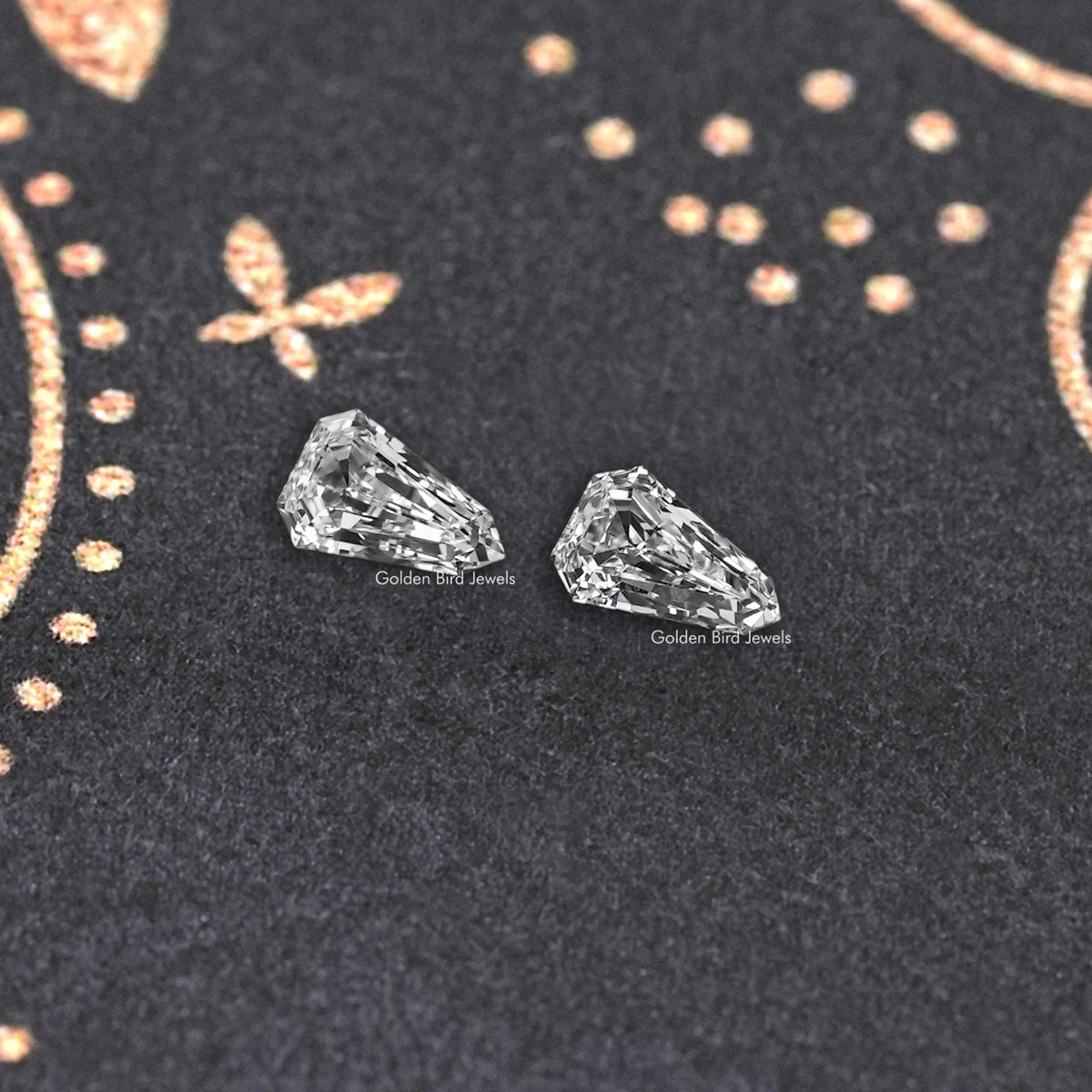 Arrow-cut lab-grown diamond pair, angled view showing faceted surfaces
