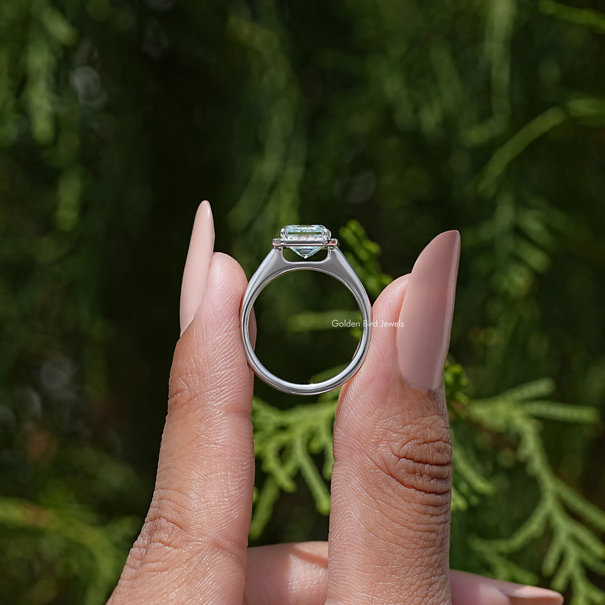 Asscher cut moissanite halo wedding ring with square center moissanite, held up