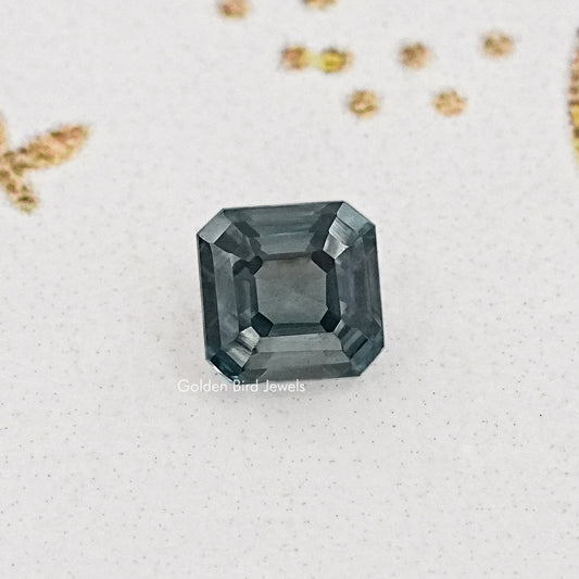 Gray asscher-cut moissanite gemstone, square step facets