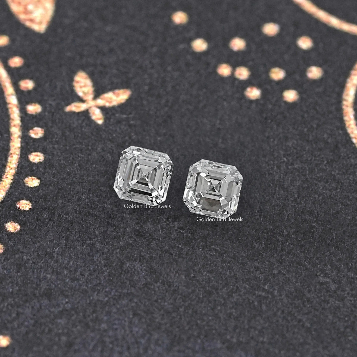 Asscher-cut lab-grown diamond stud pair with square step-cut stones, angled view