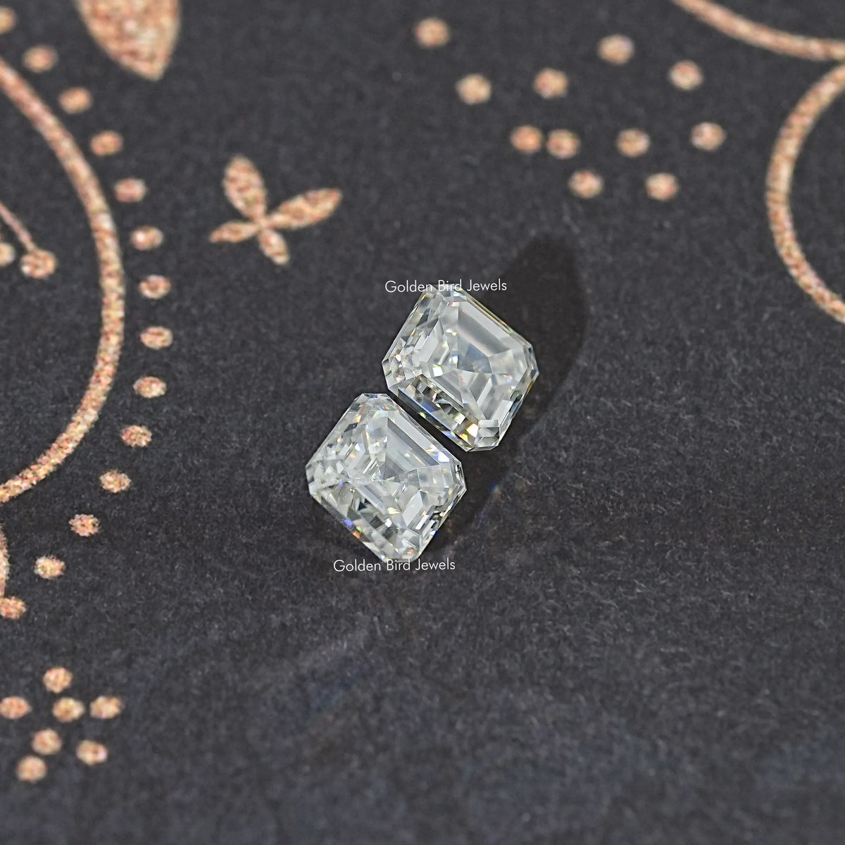 Loose matching Asscher-cut moissanite stones, two clear stones, small gap