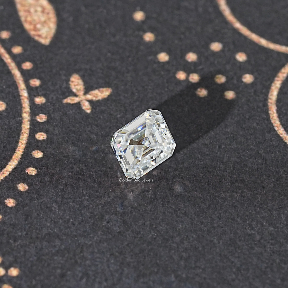 Asscher-cut colorless moissanite loose stone, angled top view with sparkle