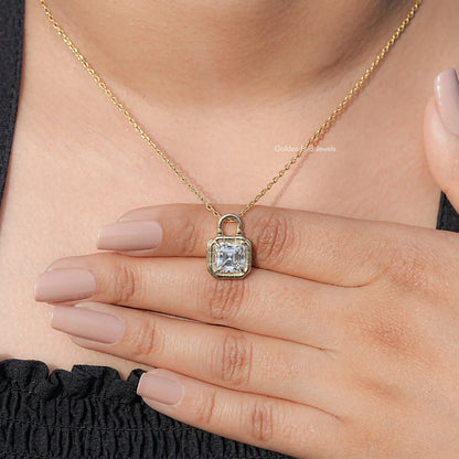 Gold-tone solitaire pendant with clear square moissanite stone and bezel setting