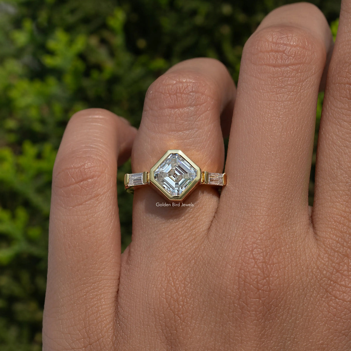 Asscher-cut moissanite three-stone ring, square center with baguette side stones