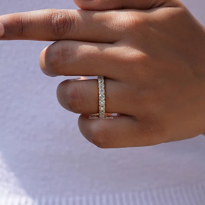 Silver-tone eternity wedding band with square-cut moissanite stones in a row