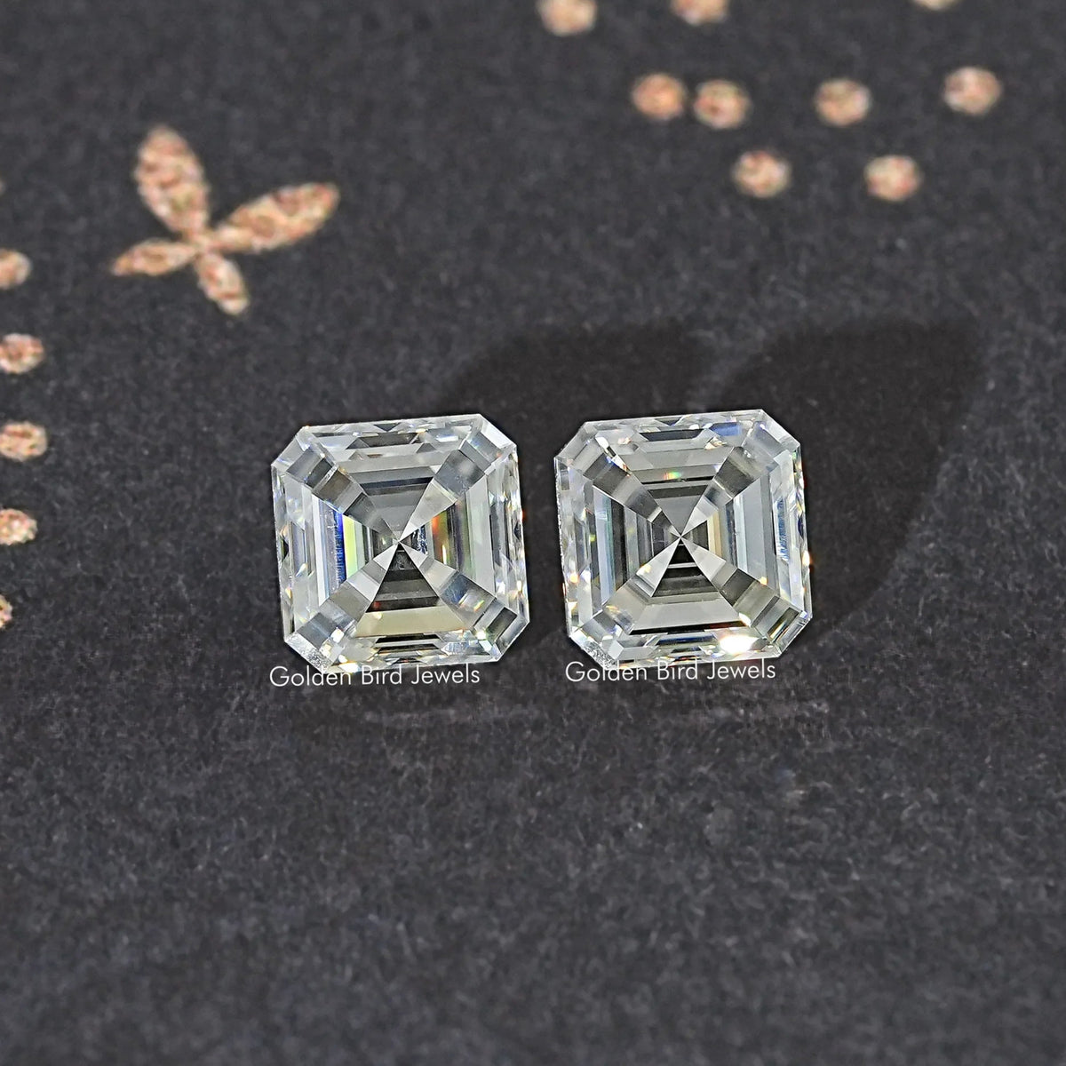 Two clear Asscher-cut moissanite stones with step facets, matching pair