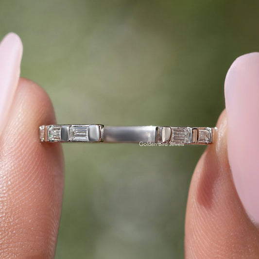 Silver open-gap band with aligned baguette stones, close-up straight-on