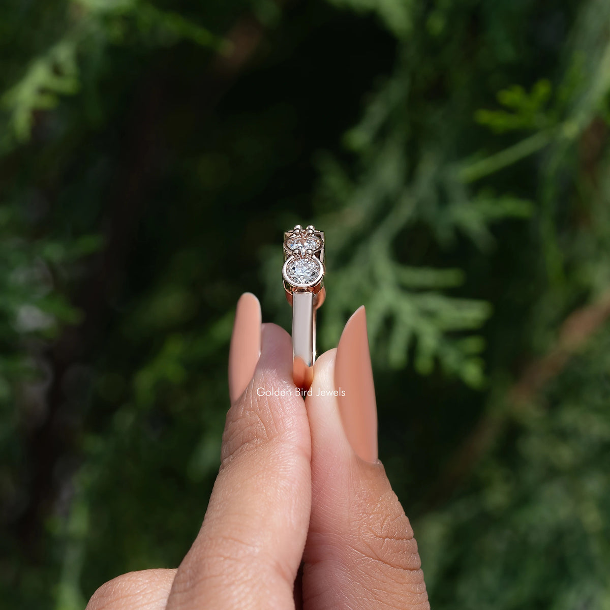 Bezel-set round diamond wedding band with metal band profile and top setting view