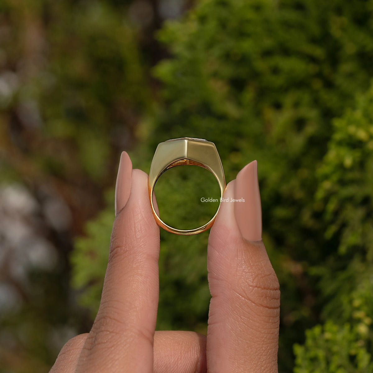 Sterling silver solitaire ring viewed from the inside, showing gold bezel back