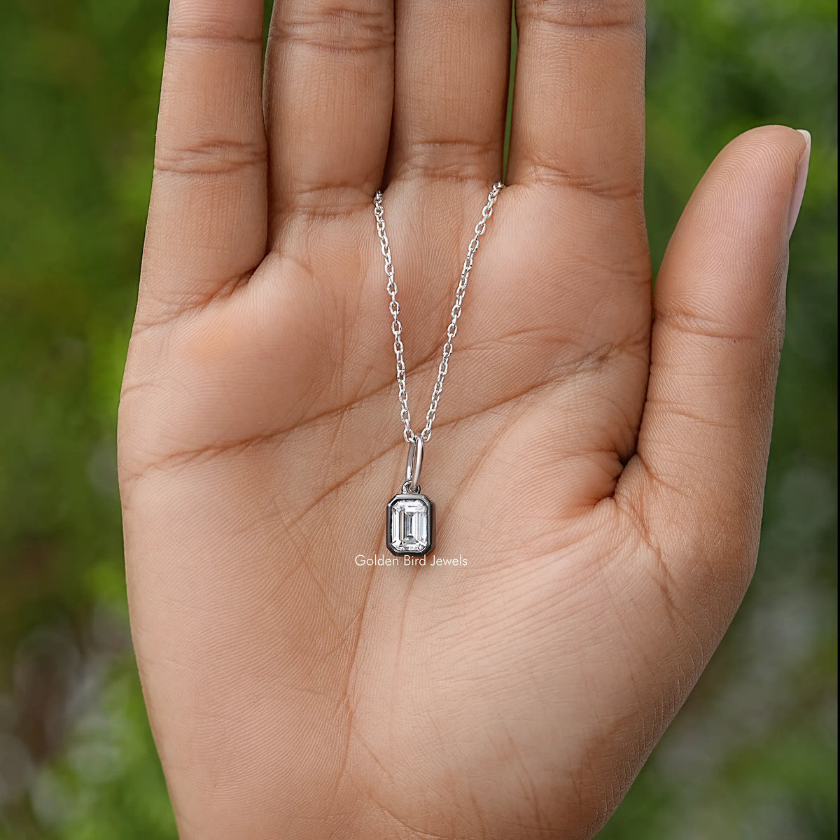 Silver solitaire pendant necklace with small rectangular bezel setting